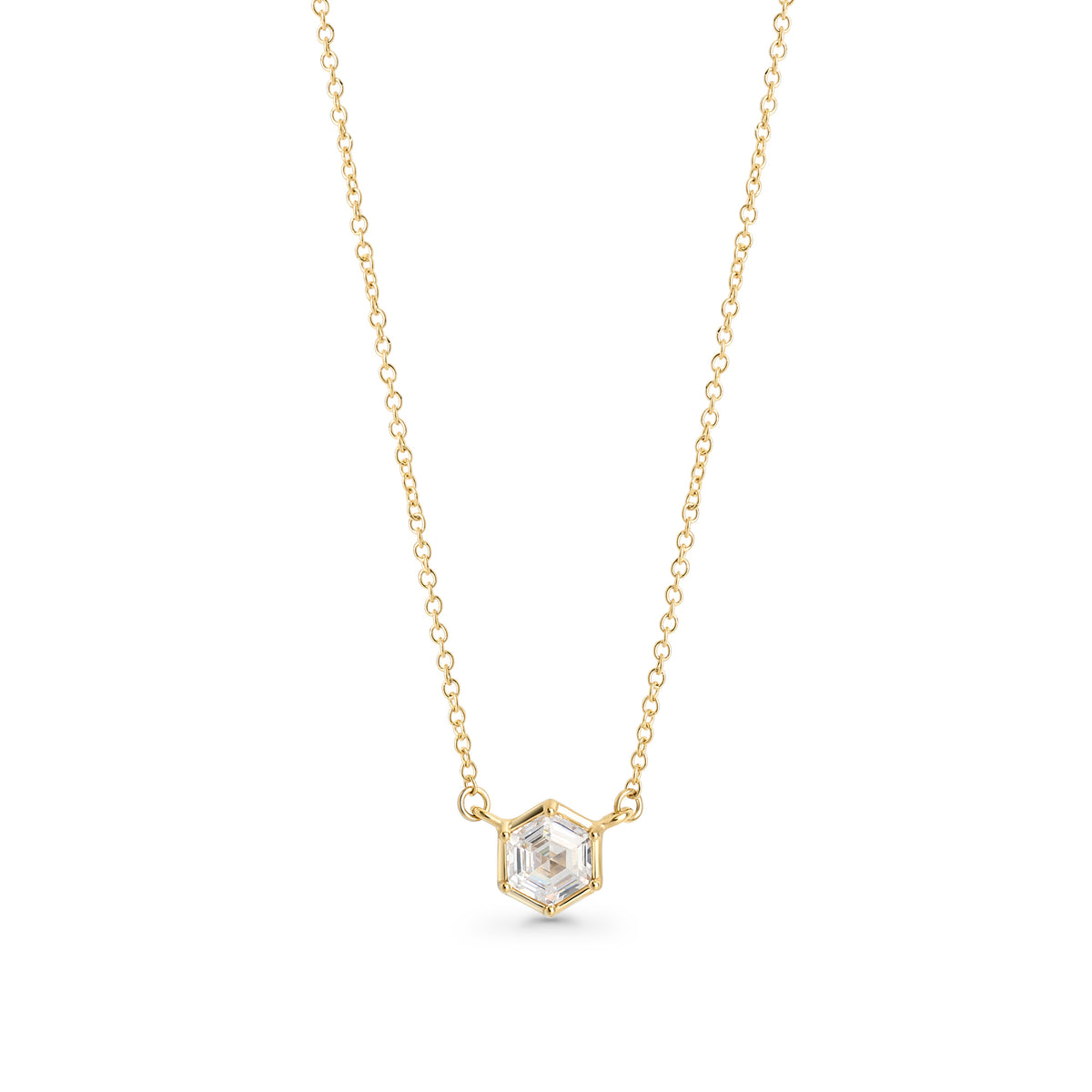 Gold stainless steel necklace with hexagon-cut cubic zirconia pendant, minimalist geometric jewelry design with brilliant stone on delicate chain.
