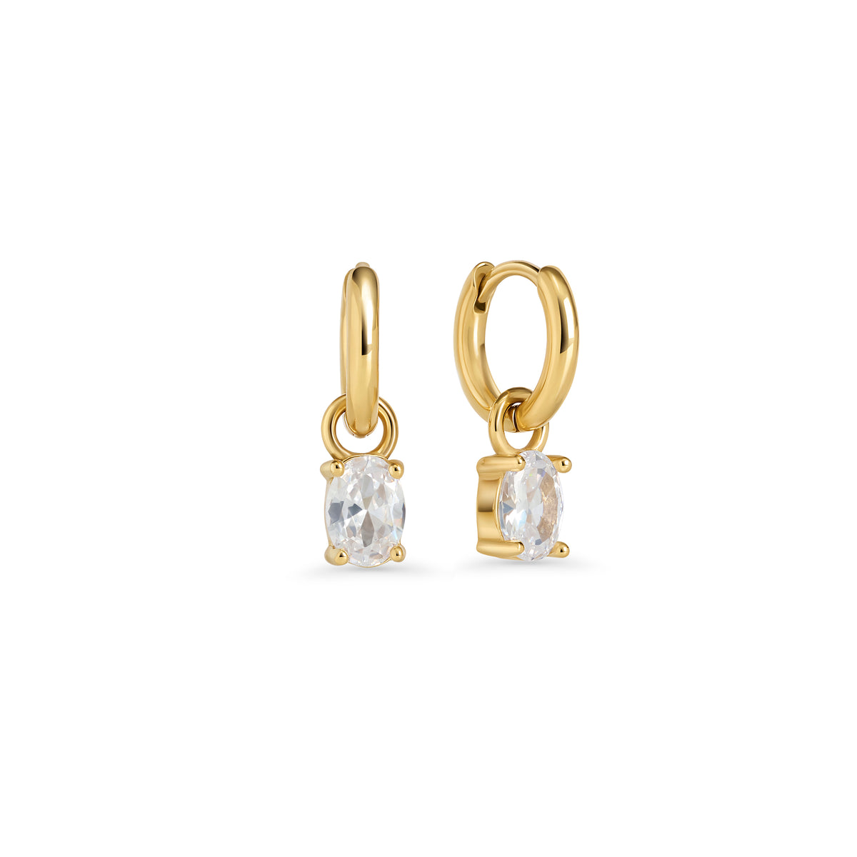 Gold hoop earrings with an oval clear stone pendant in a prong setting on a white background. Jewelry by Mia Bijoux Canada.

Boucles d'oreilles anneaux dorées avec pendentif serti sur griffes d'une pierre transparente ovale sur fond blanc. Bijoux par Mia Bijoux Canada.